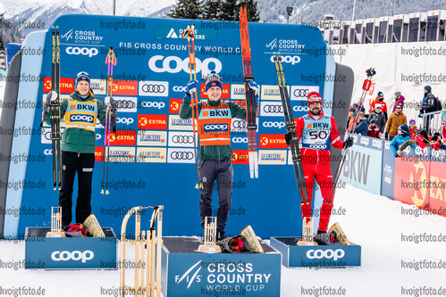 12.12.2021, xljkx, Cross Country FIS World Cup Davos, 15km Men, v.l. Simen Hegstad Krueger (Norway), Johannes Hoesflot Klaebo (Norway), Sergey Ustiugov (Russia)  /