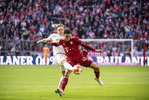 09.04.2022, Fussball, 1.Bundesliga, FC Bayern Muenchen - FC Augsburg, v.l. Robert Gumny (FC Augsburg), Jamal Musiala (FC Bayern Muenchen)