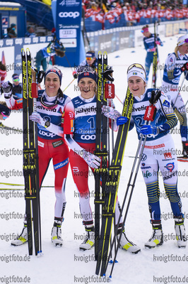 28.12.2019, xkvx, Langlauf Tour de Ski Lenzerheide, Massenstart Damen, v.l. Heidi Weng (Norway), Therese Johaug (Norway) and Ebba Andersson (Sweden) im Ziel / in the finish