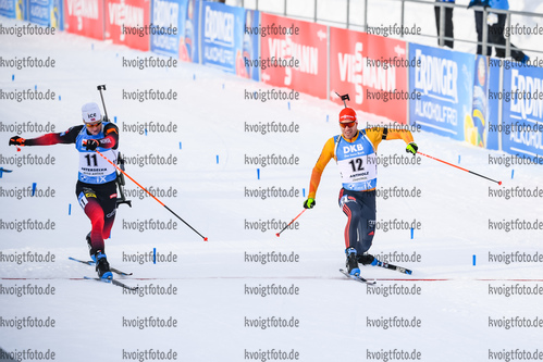24.01.2021, xkvx, Biathlon IBU Weltcup Antholz, Massenstart Herren, v.l. Vetle Sjaastad Christiansen (Norway) und Arnd Peiffer (Germany)  / 